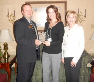 David Hill, Chamber President, presents Stacy Perkins and Lisa Dove with Ridge Park Square (Zeisler Morgan Properties) with their award.