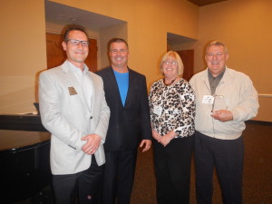 Chris Ellis, Chamber President, and David Nodge, Chamber Vice President, presented Ed Gonzalez and Rose Ortosky with their Large Business Member of the Year award at our November 12th Holiday Social.